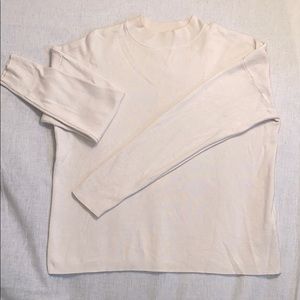 Cream crew neck sweater: slightly cropped